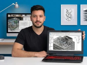 Wolfgang Schoenbeck, instructor del curso de instalaciones HVAC con Revit, mostrando en un notebook la red de climatización de un edificio modelada en Revit
